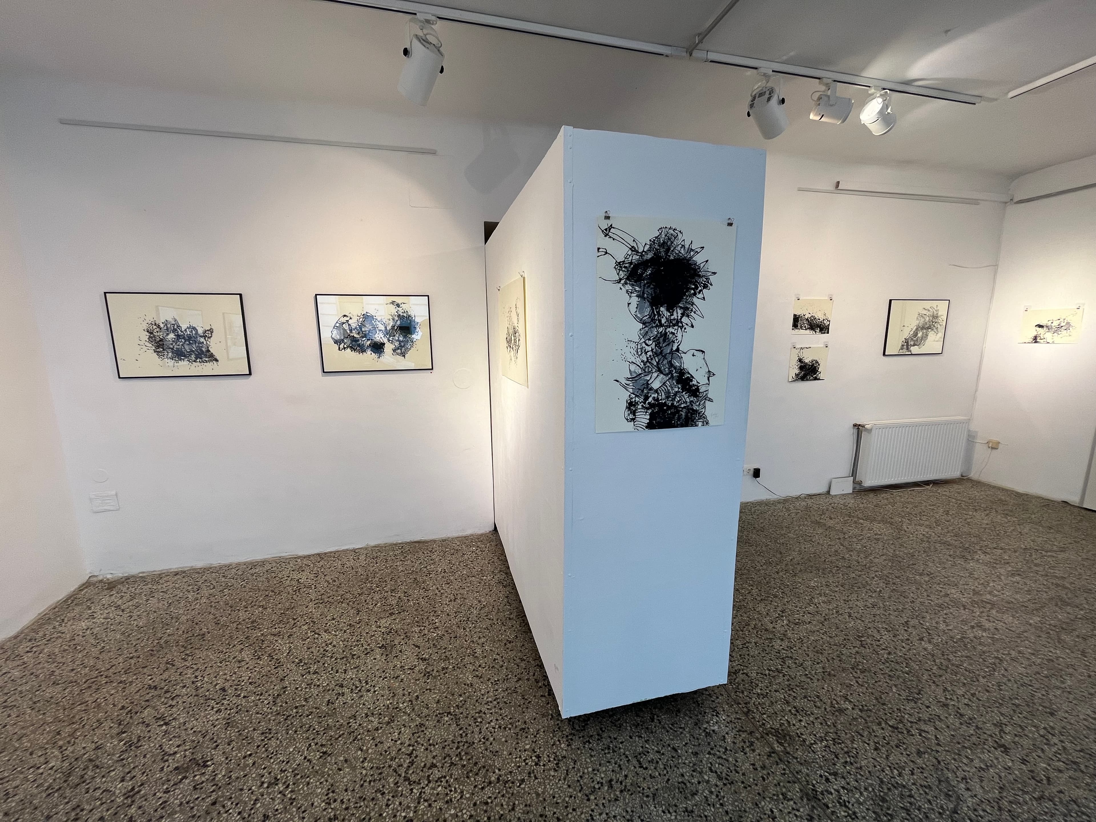 Gallery with black and white abstract paintings